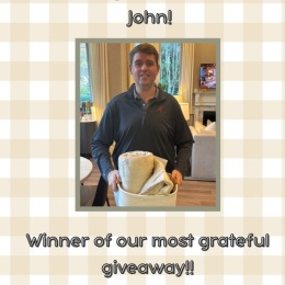 a person holding a basket and a blanket